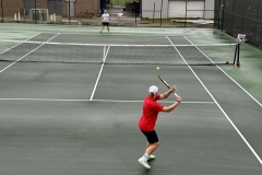 Ethan Tyson sets up for a solid return during the region tournament