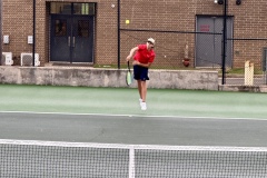 Jackson Christian serves the ball during the first round of the region tournament