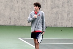 McBroom looks upward at his supporters after slipping on the wet courts