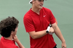 Ethan Tyson and Hayes McBroom in mid-discussion during a rain delay