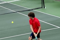 Trojans doubles player, Carter McBroom gets in position for a backhand