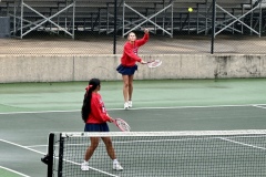 Senior, Abby Tacbianan watches as her teammate serves the ball.