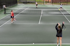 Jaelyn Marlowe watches as her teammate, Hayden Cook, serves the ball