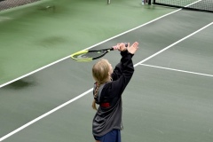 Senior, Hayden Cook serves the ball prior to victory over the Temple Tigers