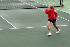 Sophomore, Taryn Dender retreats back to cover the backside of the court during a doubles match