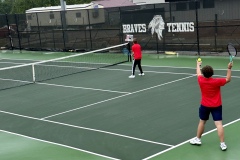 Carter McDaniel prepares for serve against Temple