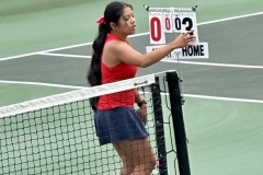 Abby Tacbianan flips the score card after a win