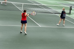 Jaelyn Marlowe fires a shot back across the net during a doubles match