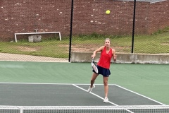 Sydney Bacon returns the ball during a region championship match against Heard County