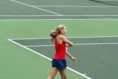 Taryn Dender hits the ball from the back of the court