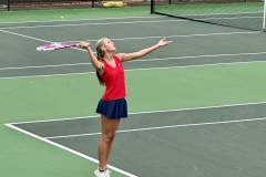 Taryn Dender serves the ball in a match against Heard County