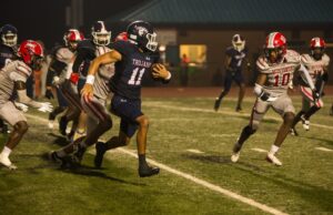 Trojans Tame Mustangs in Region Opener